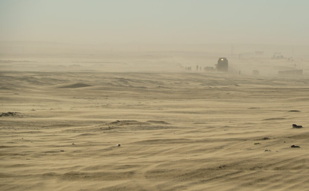 Train getting dug out of the sand at Dune 7 in a storm, with no recovery optimism 